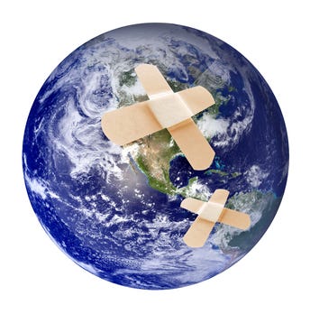 A globe patched with bandages, symbolizing a world of overlapping crises